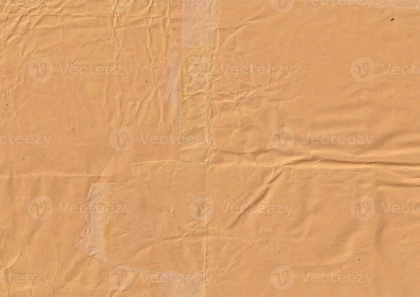 Brown crumpled paper texture background for overlay. Old and used cardboard backdrop template. photo