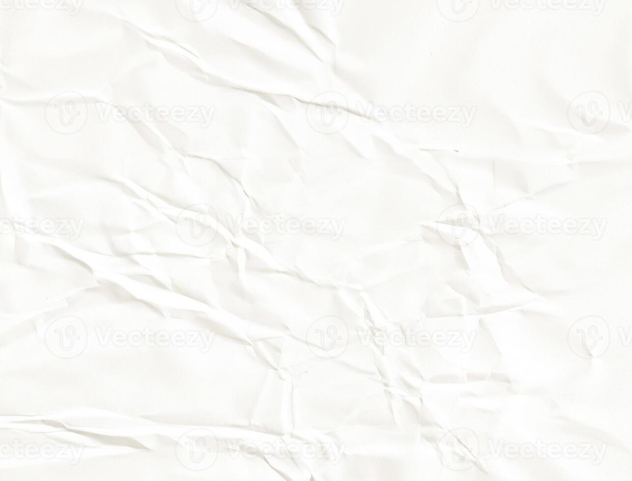 Crumpled white paper texture with natural folds and creases, ideal for backgrounds or design overlays photo