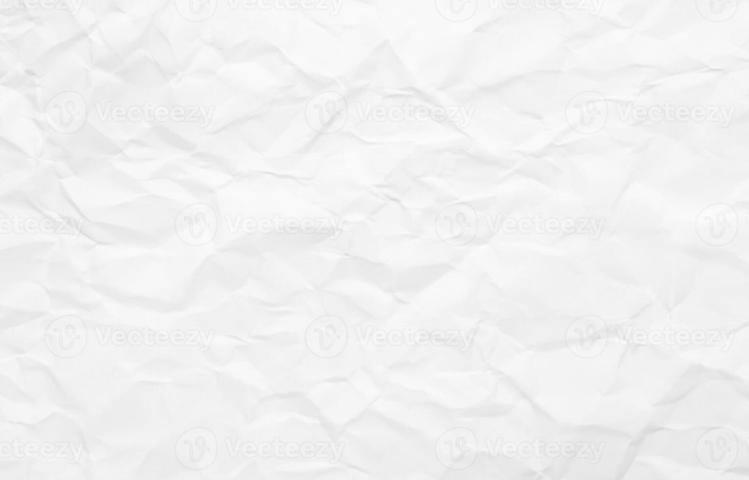 Wrinkled white paper texture with light folds and shadows, perfect for grunge or creative design use. photo