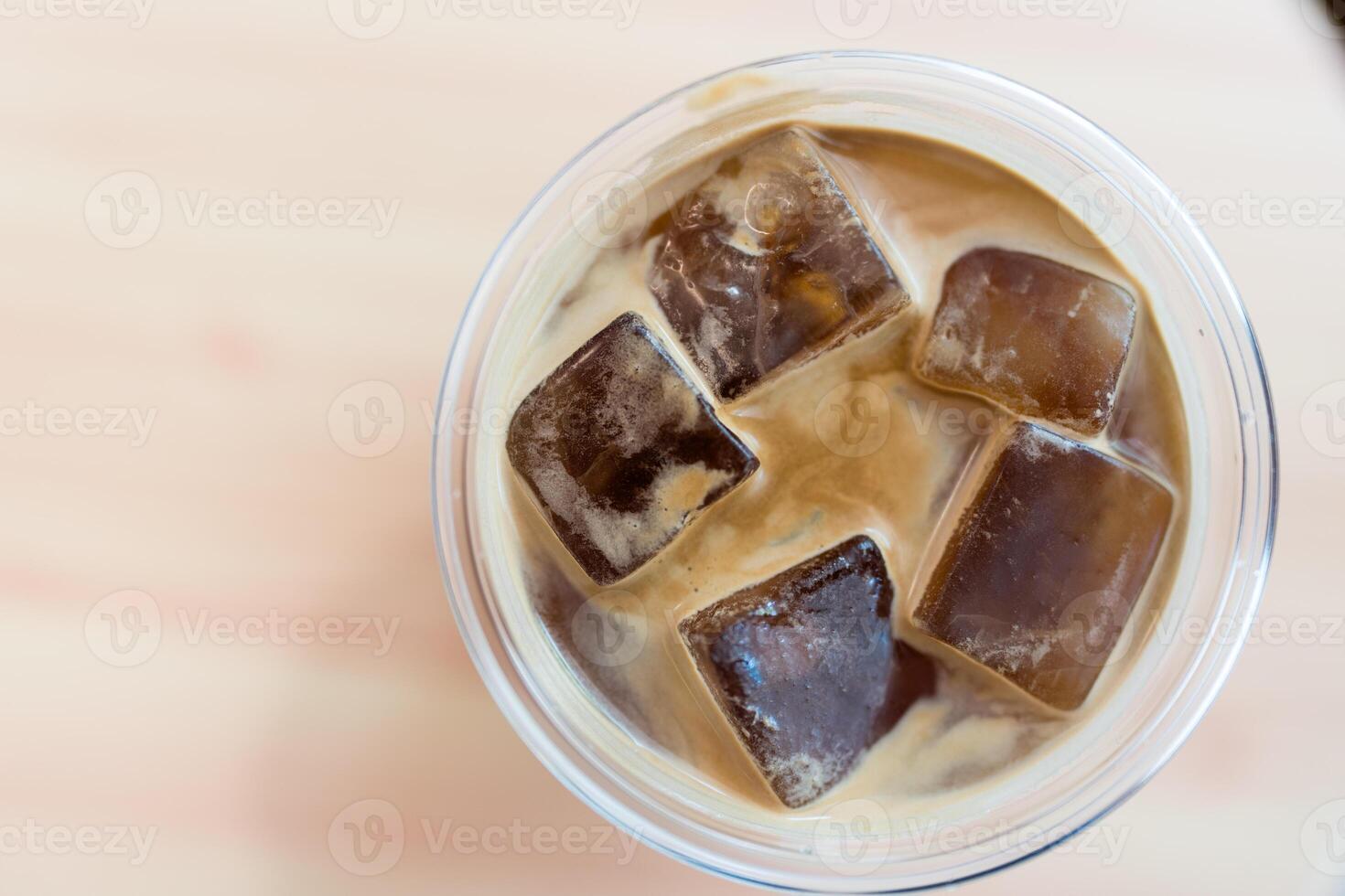 Tasty cold Americano coffee with full of ice cubes photo