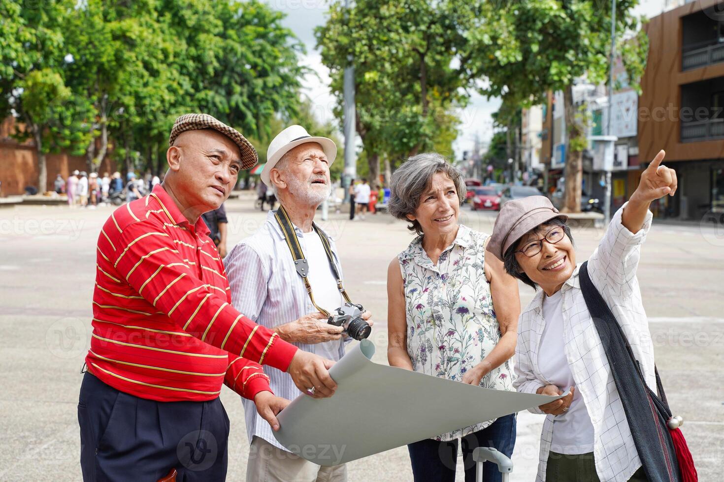Group of senior tourist are looking at city maps to find tourist attractions in Chiang mai city. photo