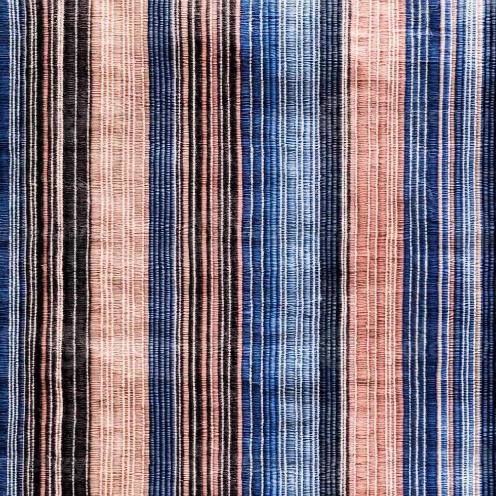 A close up of a striped fabric with blue, pink and white stripes photo