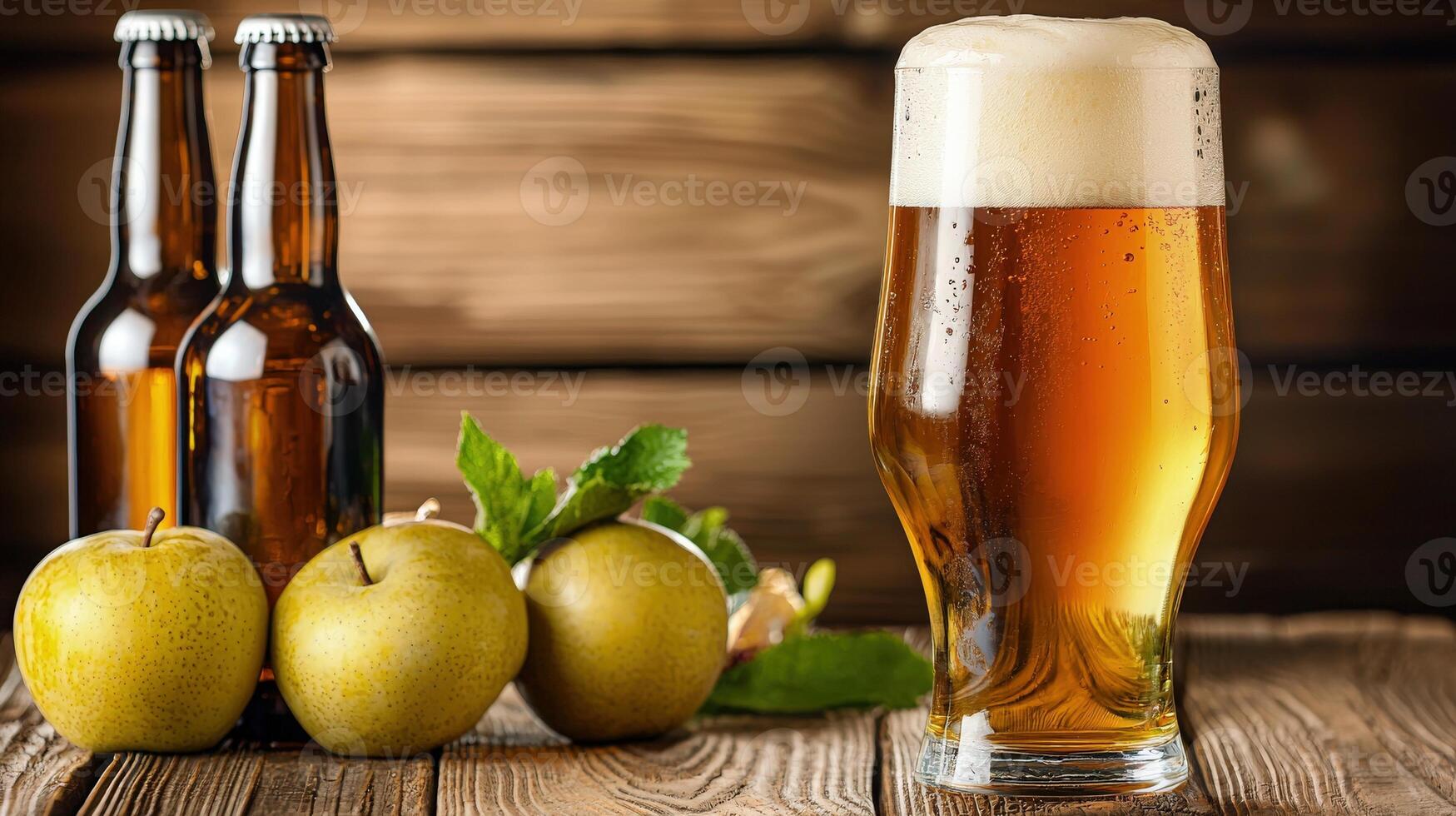 A glass of beer and two apples on a wooden table photo