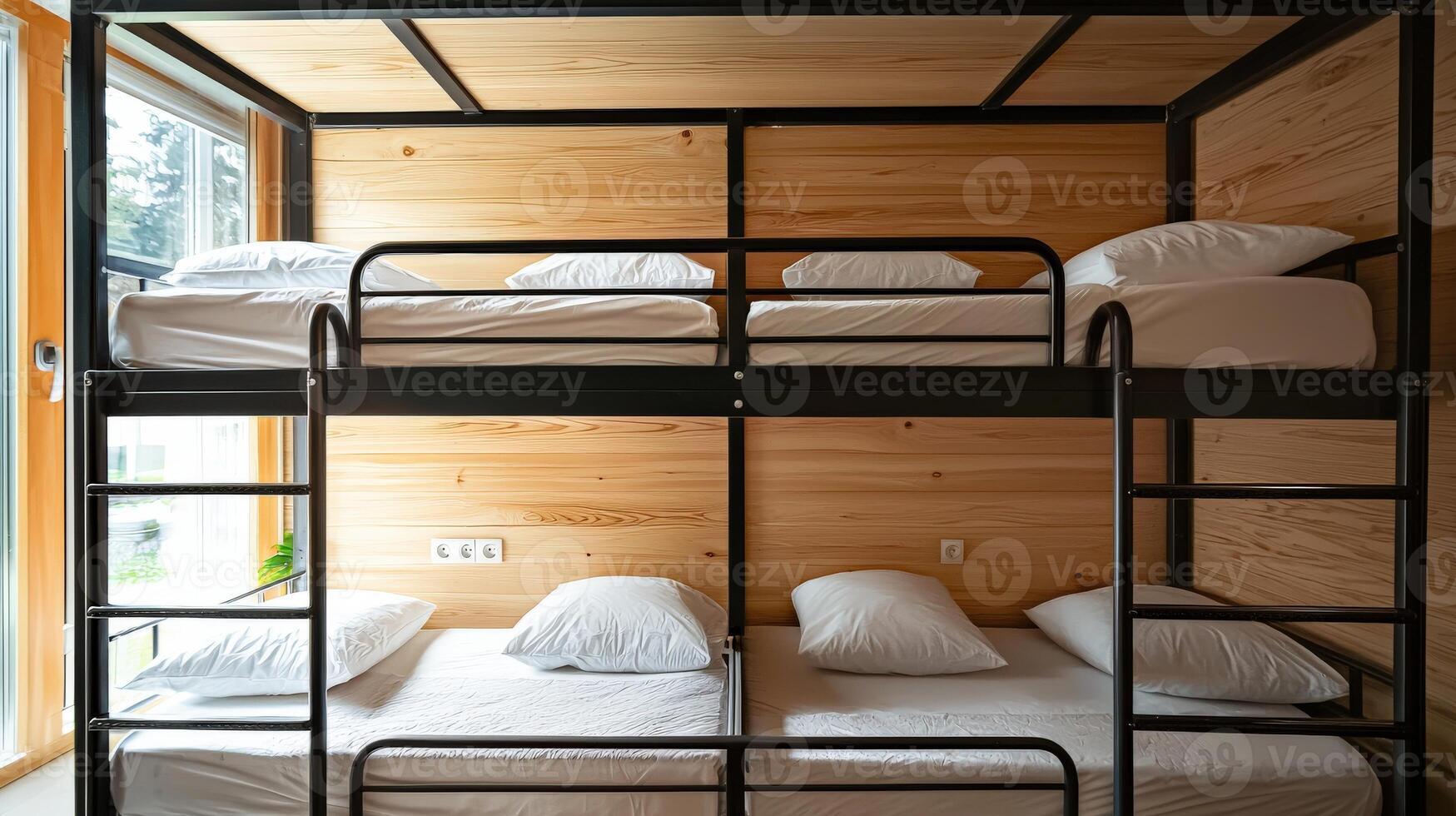 A bunk bed with white sheets and black metal frames photo