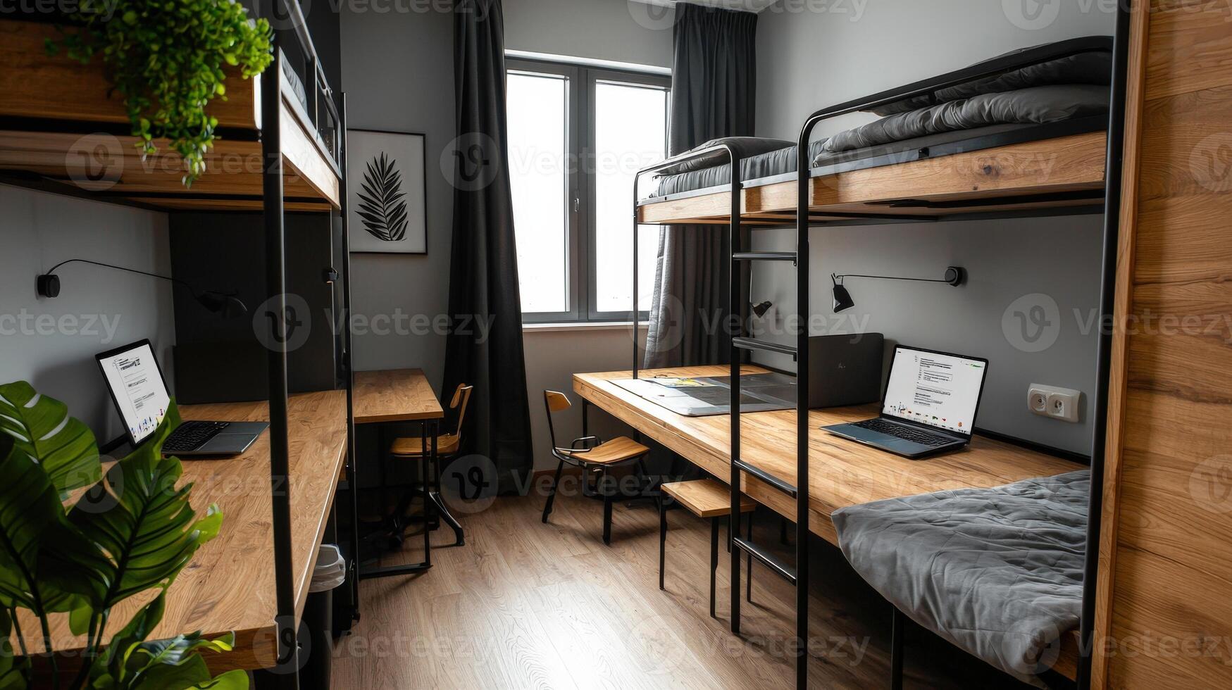 A bunk bed with two desks and a laptop photo