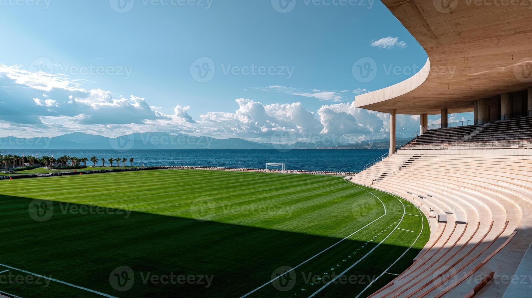 An empty stadium with a view of the ocean photo