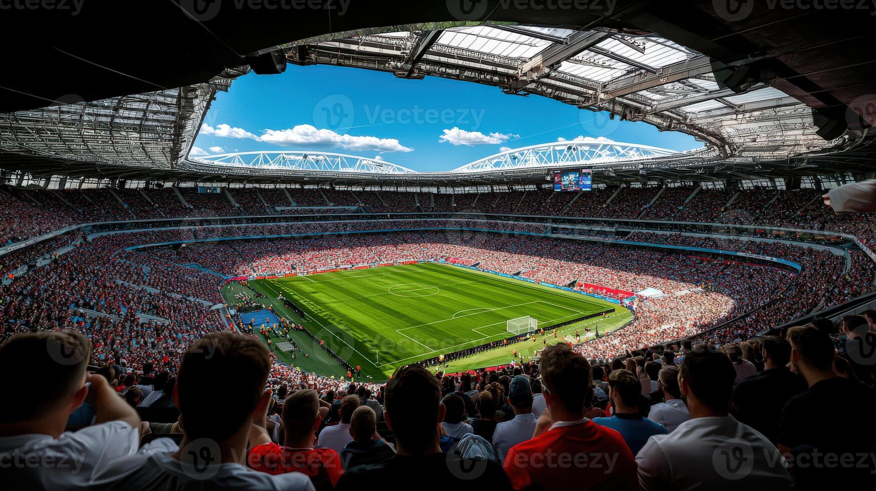 A large stadium with people watching a soccer game photo
