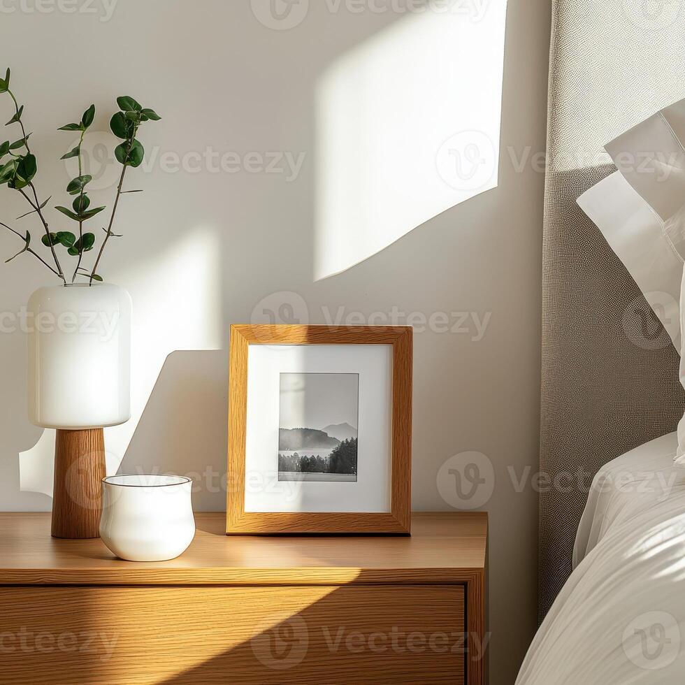 A bedside table with a plant and a picture photo