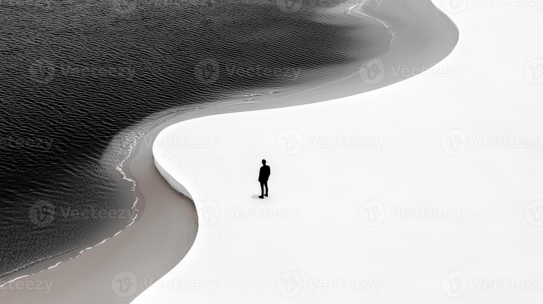 A man standing on the edge of a wave photo