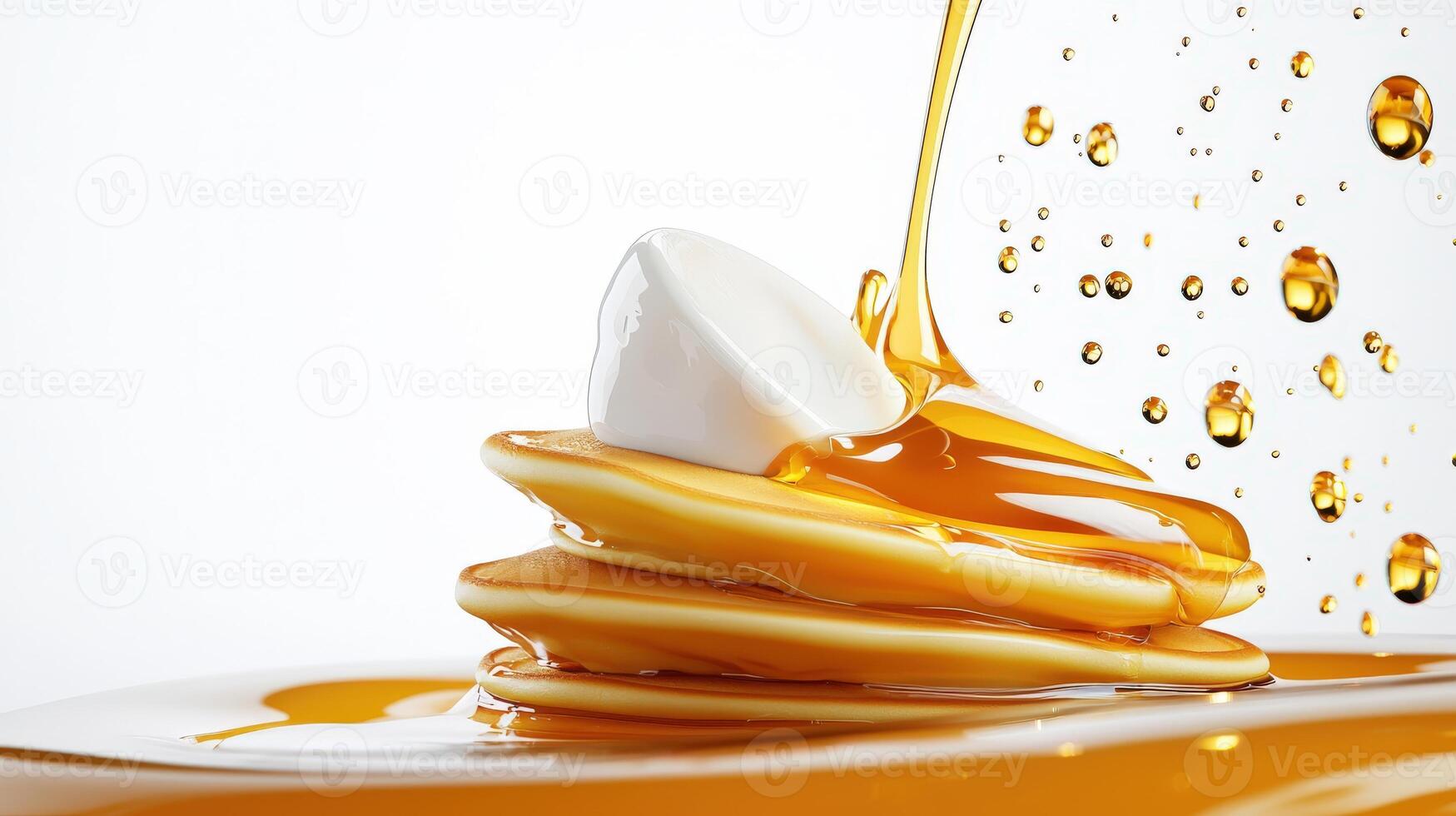 Pancakes with syrup being poured over them photo