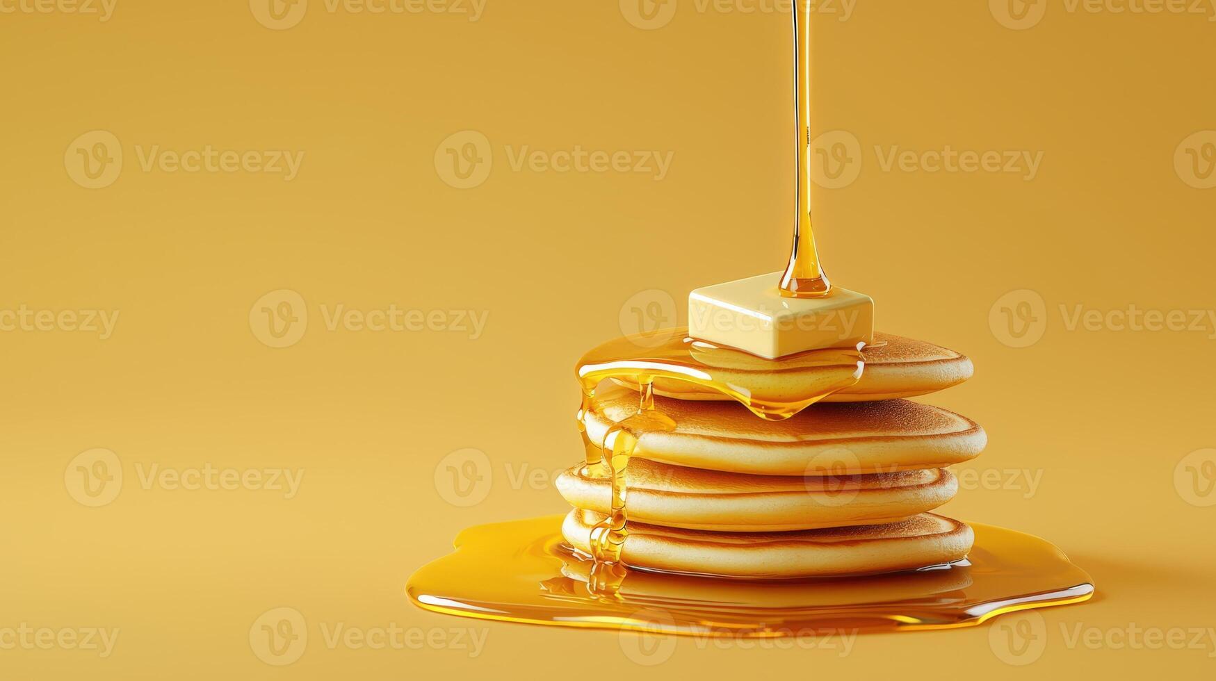 Pancakes with syrup and butter on yellow background photo