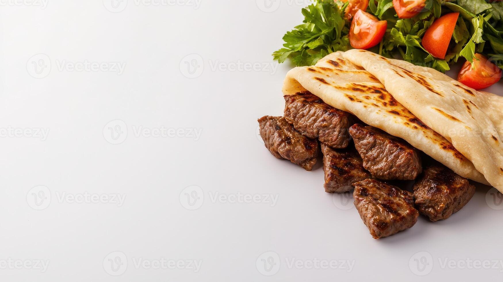 Grilled beef kebab with pita bread on white background photo
