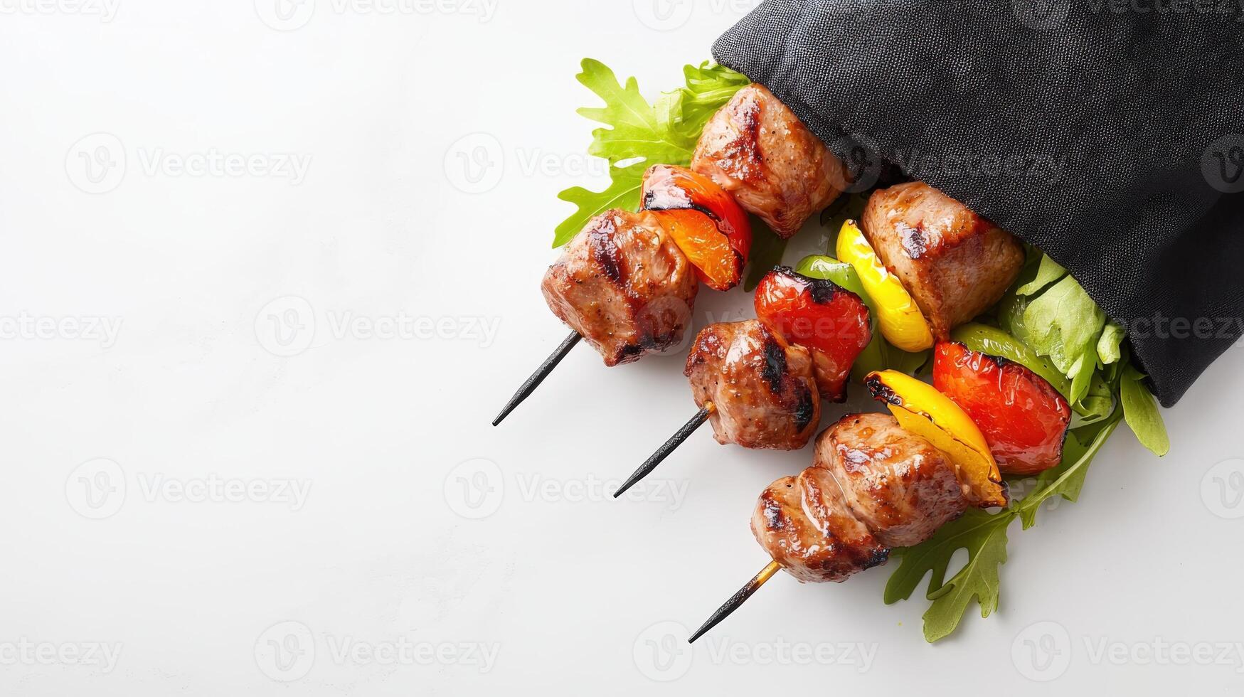 Grilled meat skewers with vegetables on a white background photo