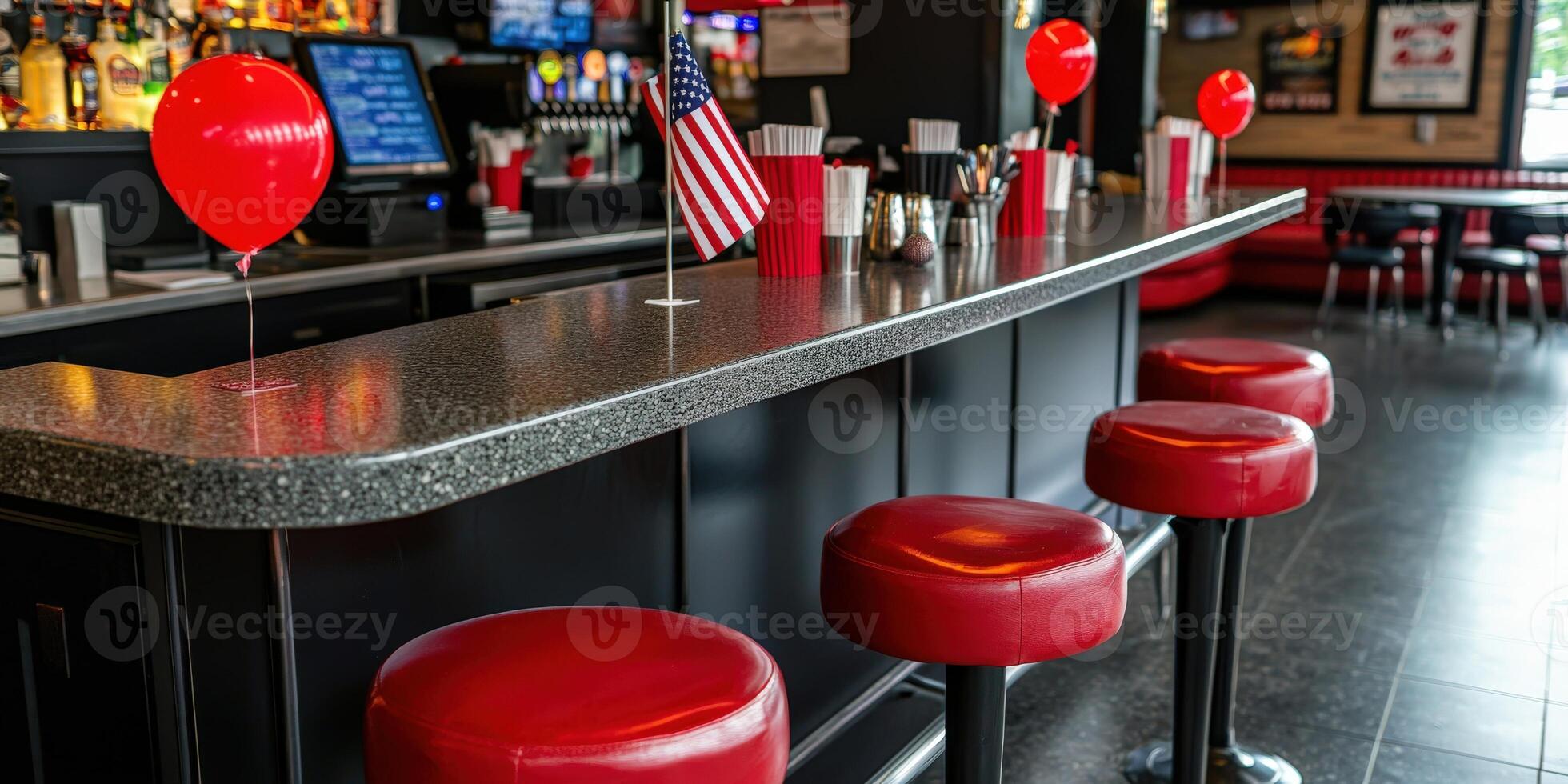A bar with red stools and balloons photo