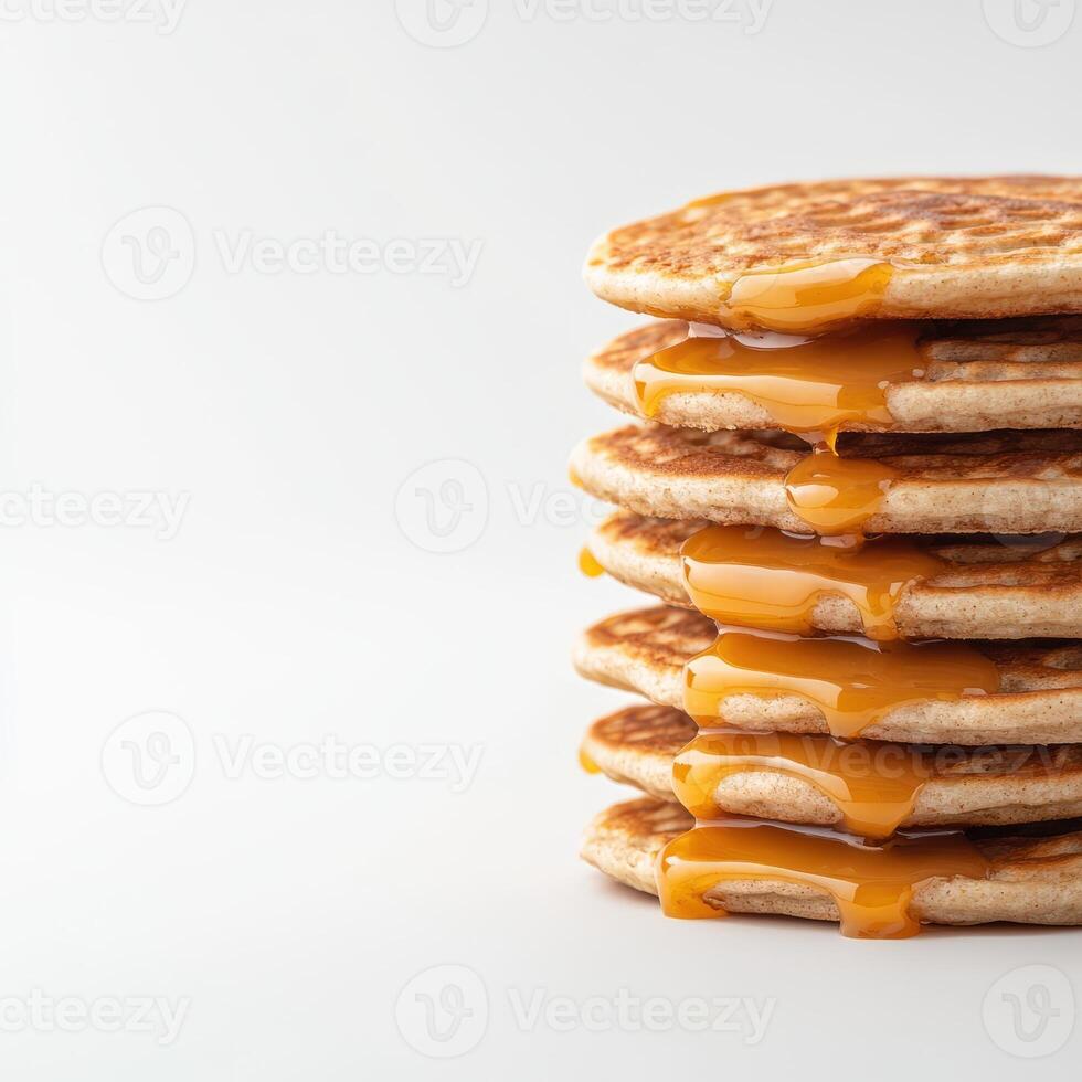 A stack of pancakes with caramel syrup on top photo
