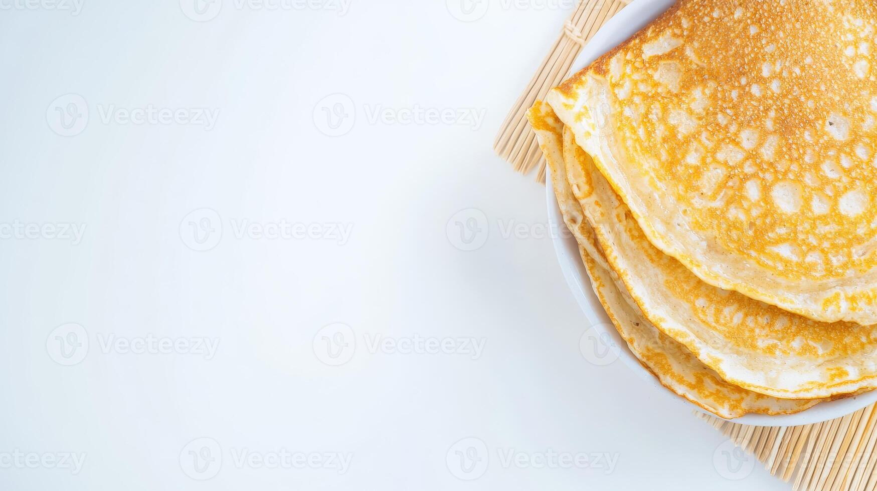 A stack of pancakes on a white plate photo