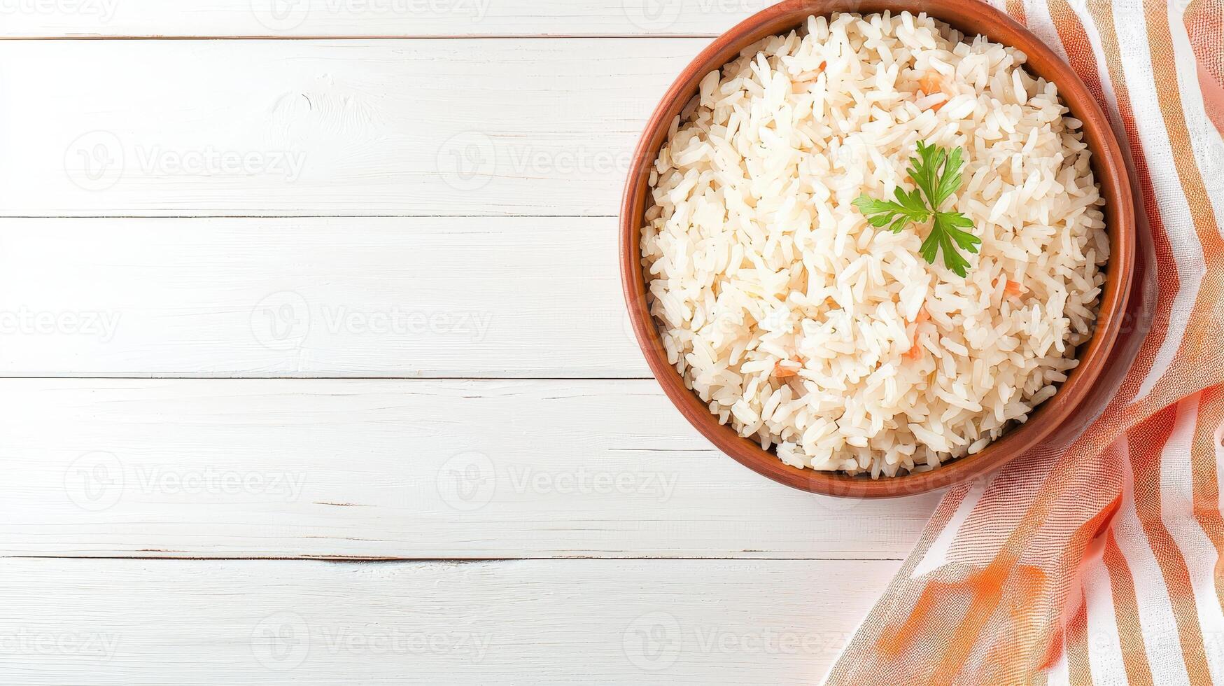 Rice in a bowl on a white wooden table top view photo