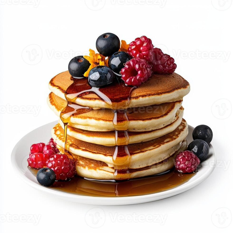 A stack of pancakes with berries and syrup photo