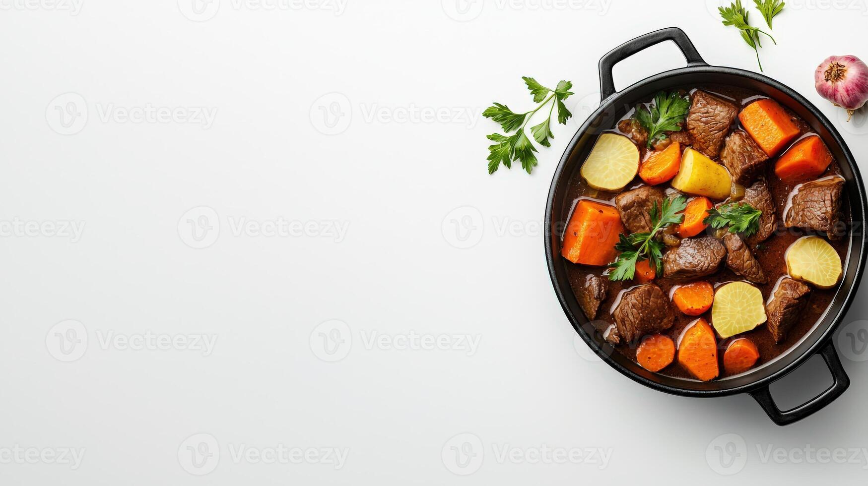 Beef stew in a black pan on a white background photo