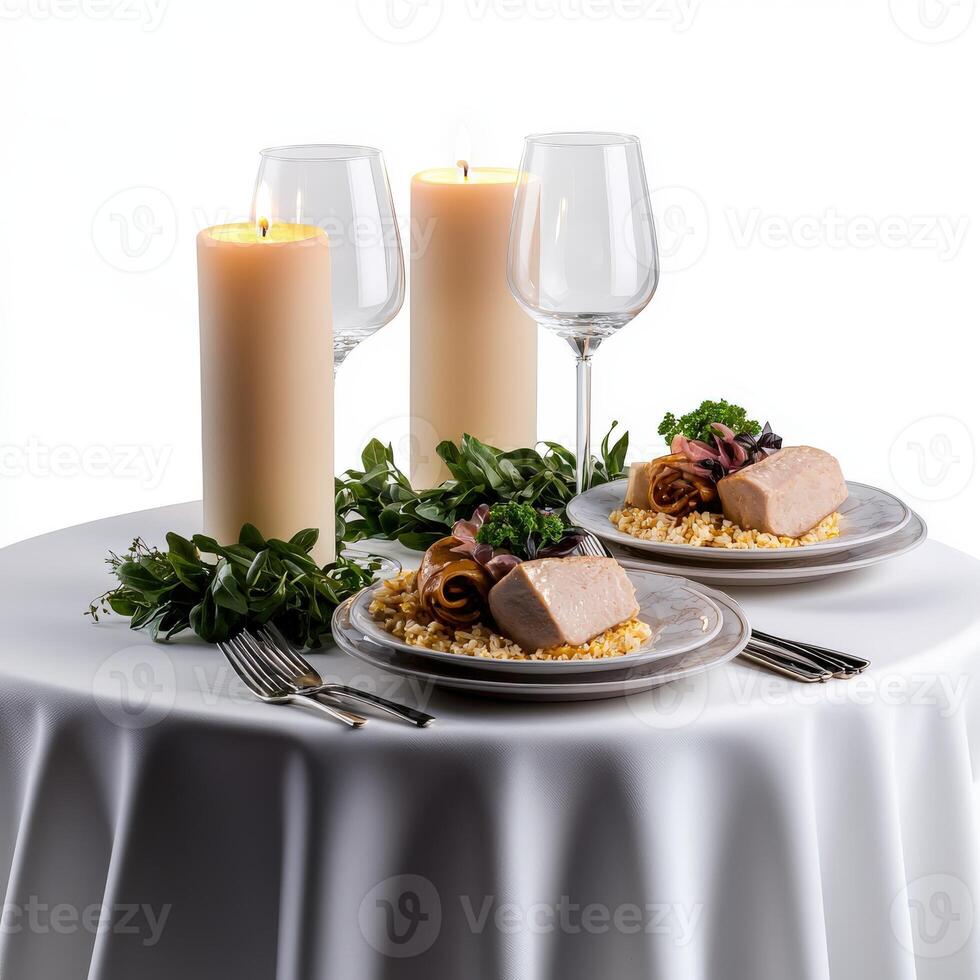 A table with two plates of food and two candles photo