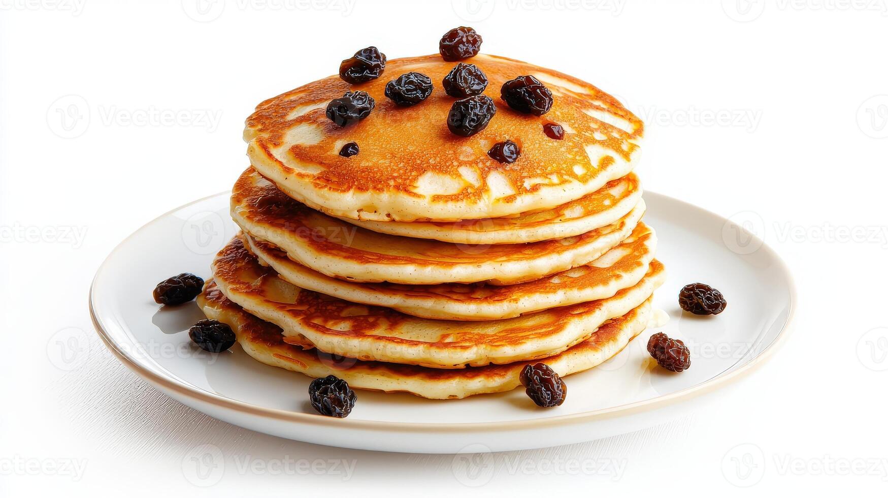 A stack of pancakes with raisins on top photo