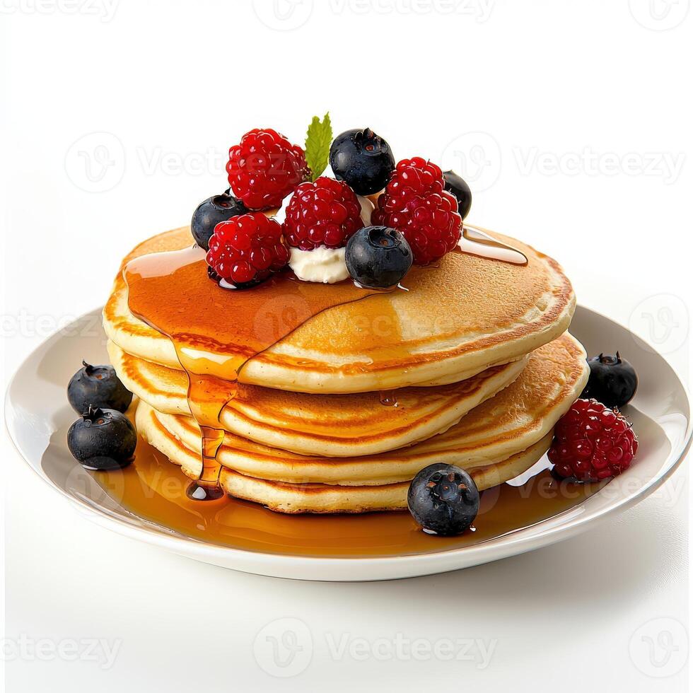 A stack of pancakes topped with berries and syrup photo