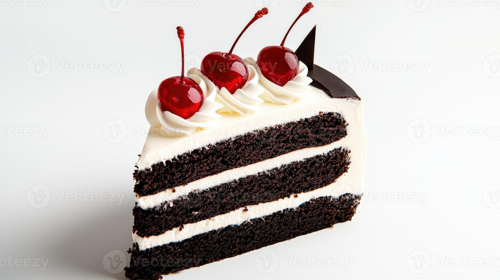 A piece of cake with white frosting and cherries photo