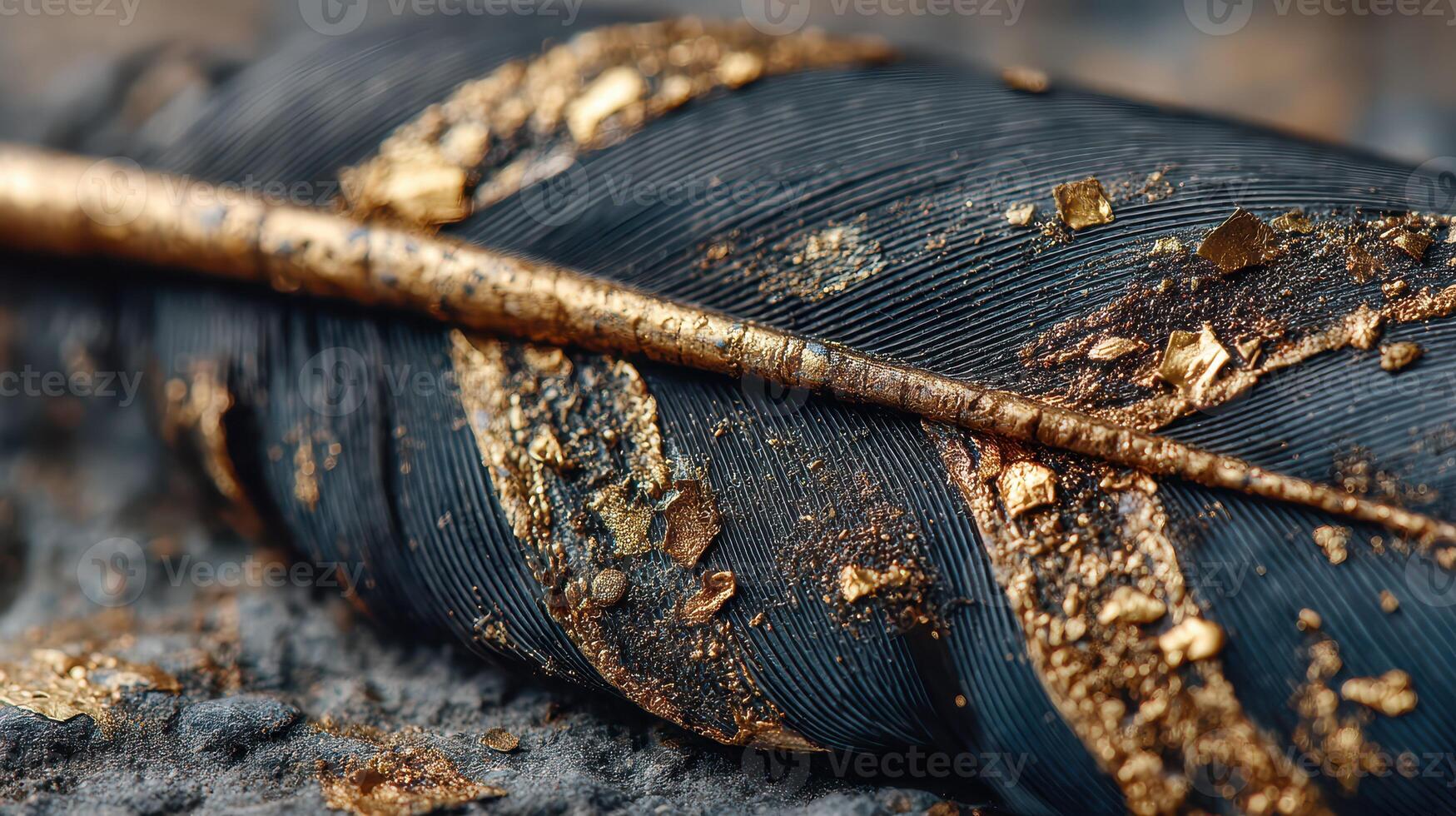 Golden dust covers a black feather resting on a textured surface in an artistic composition photo