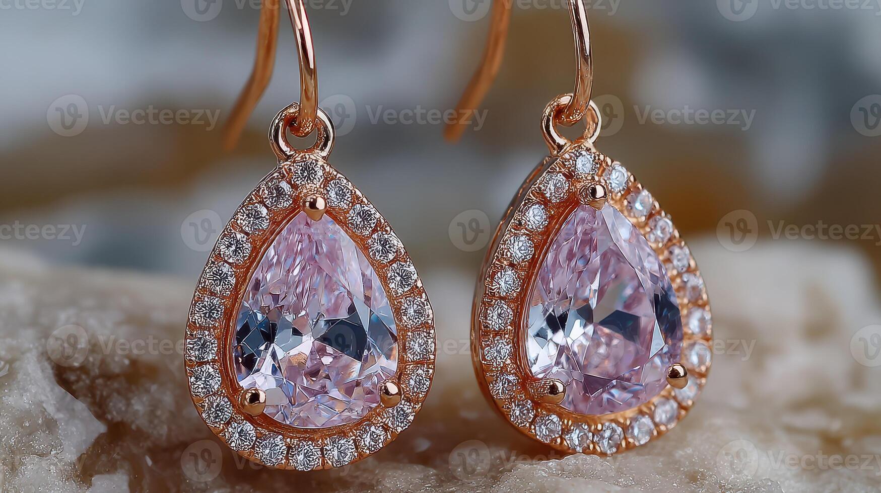 Elegant rose gold earrings with sparkling pink gemstones displayed on a textured surface at a close angle during daylight photo