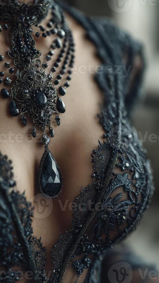 Elegant black lace and jewelry create a striking look at an indoor fashion showcase in the afternoon light photo