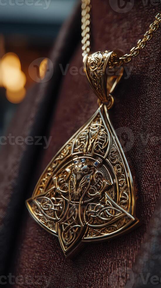 Intricate golden pendant displayed on velvet showcasing exquisite craftsmanship and design details photo
