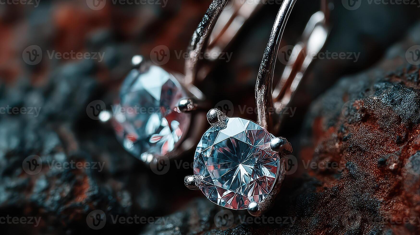Elegant diamond earrings displayed on a textured dark surface in a stylish setting showcasing their brilliance photo