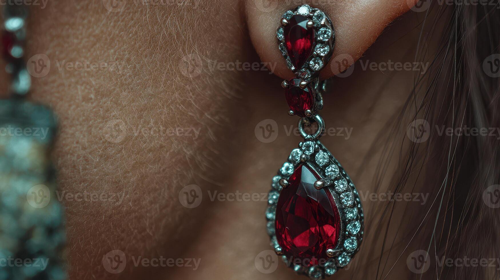 Elegant red gemstone earrings displayed on a woman in a close-up setting with a focus on intricate design and shine photo
