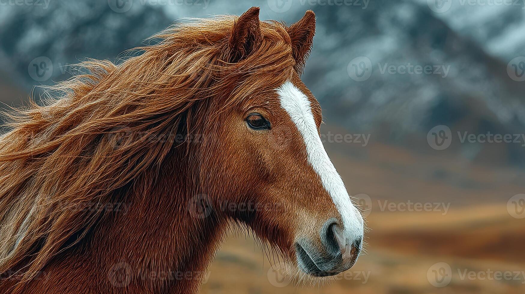 Majestic horse with flowing mane stands confidently in a picturesque mountainous landscape during golden hour photo
