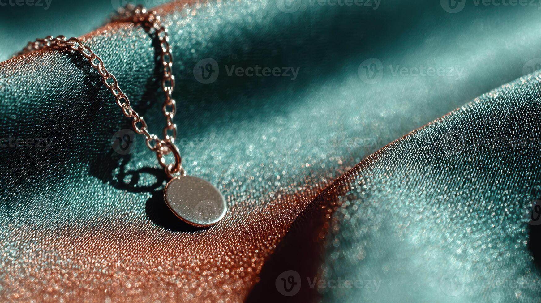 Elegant silver necklace resting on shimmering fabric at a luxurious display, showcasing its intricate design in natural light photo