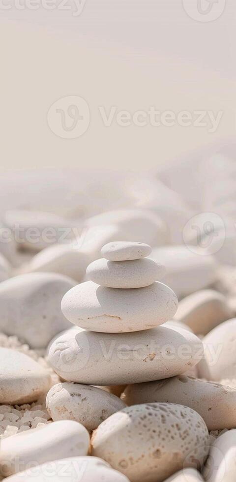 A stack of white rocks on a beach photo