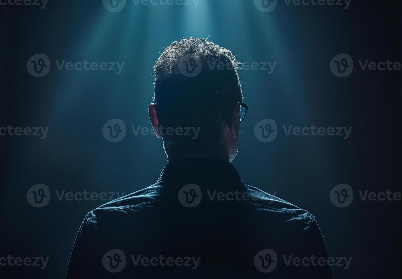 The Enigma of the Silhouetted Figure in a Spotlight's Embrace photo