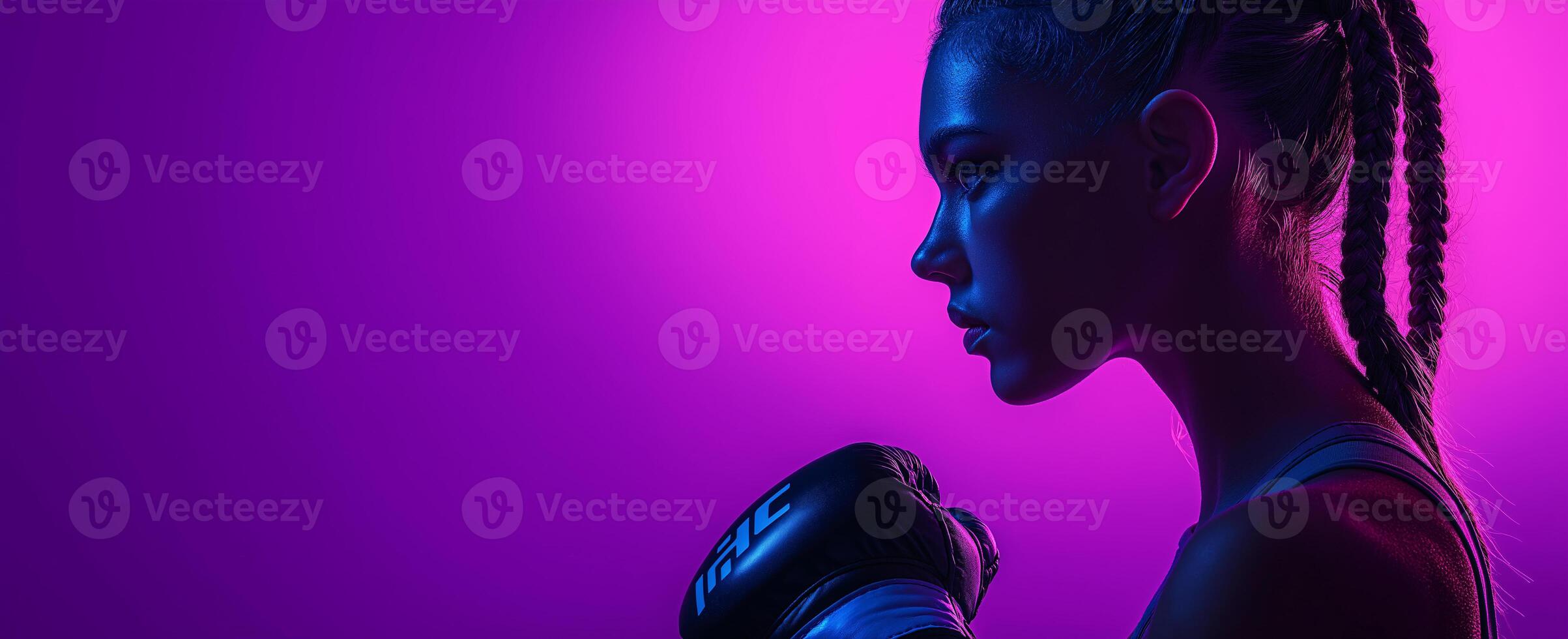 A strong woman wearing a boxing glove is standing in front of a purple background photo