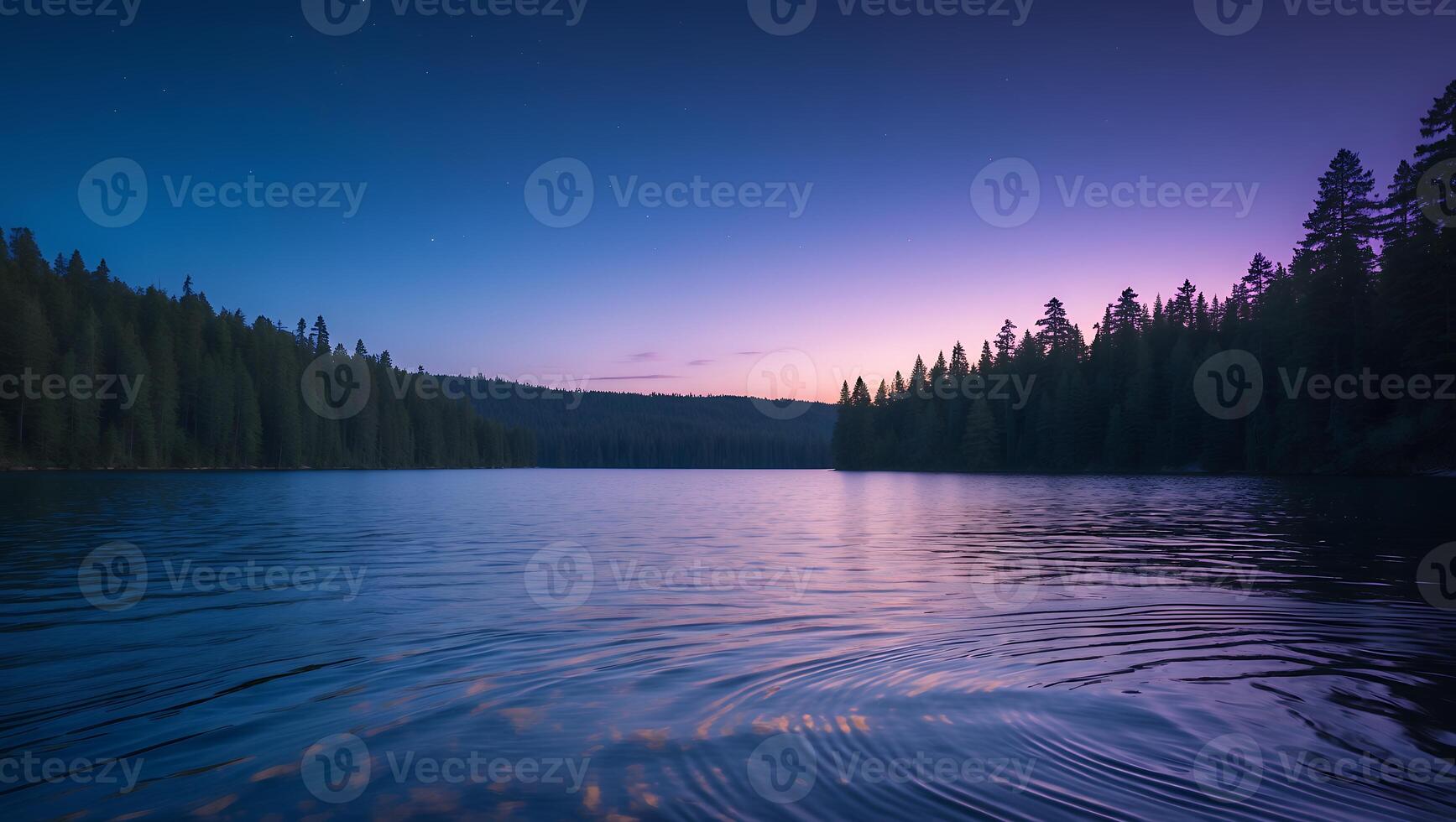 Still Lake Reflecting Colorful Twilight Sky Surrounded by Forest Trees photo