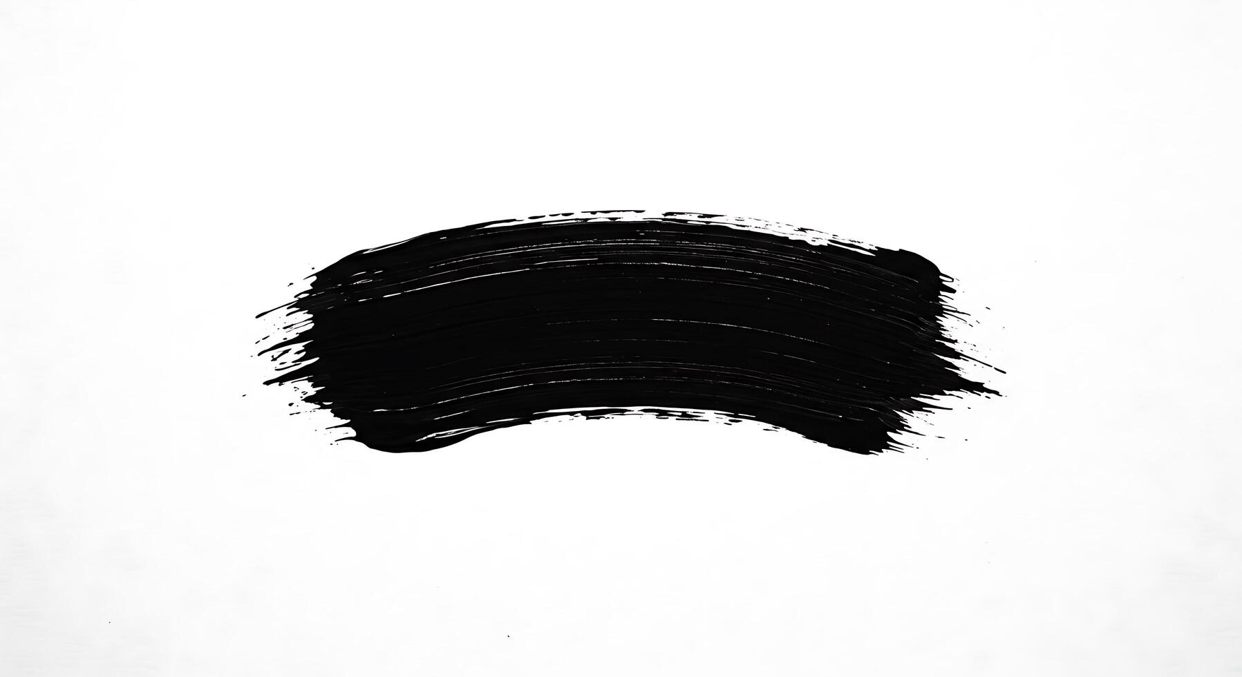 A black brush stroke on a white background photo