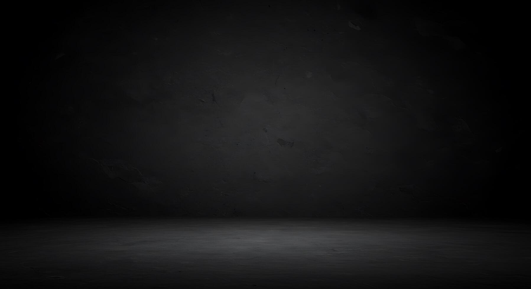 Dark room with concrete floor and black walls photo