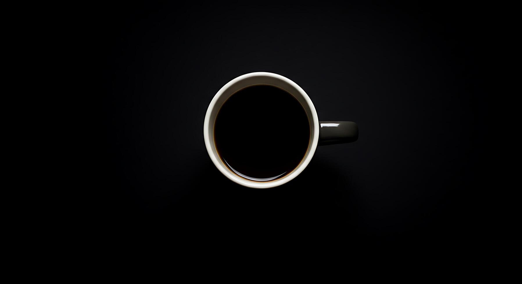 A cup of coffee is shown on a black background photo
