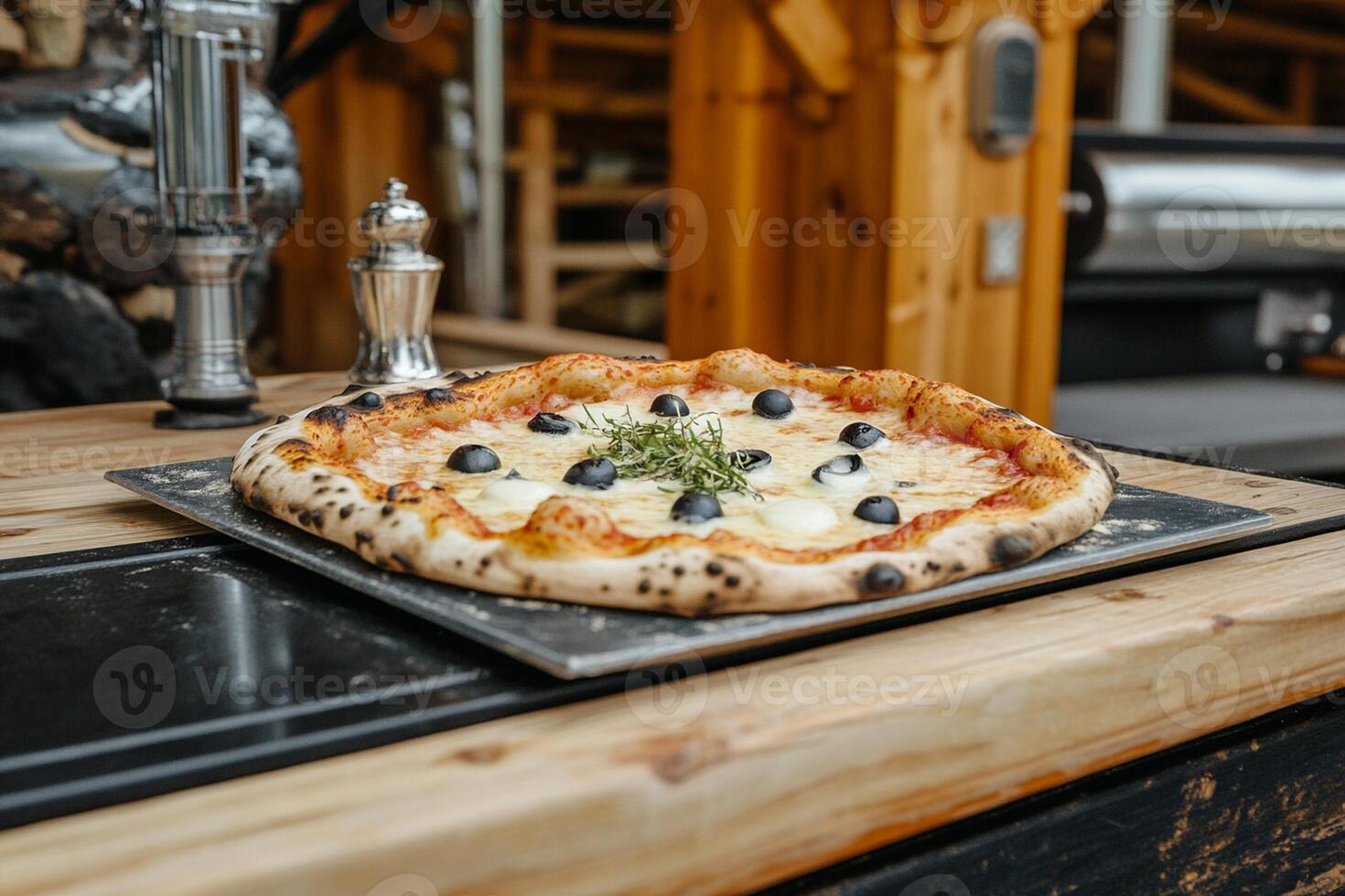 A pizza on a metal tray photo