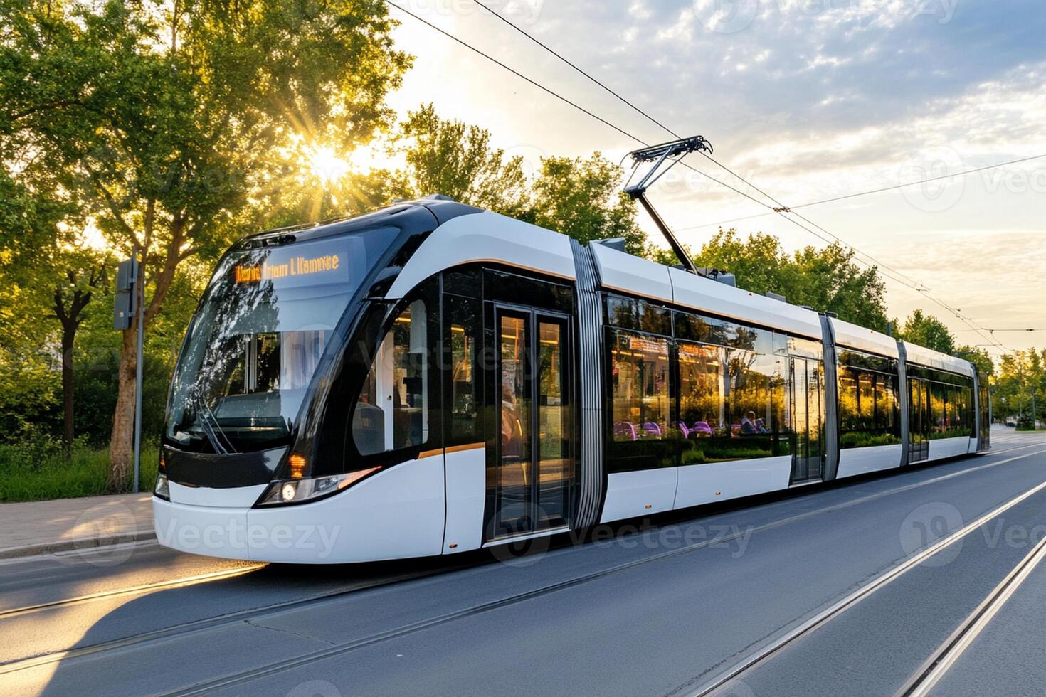 A modern tram is driving down the street photo
