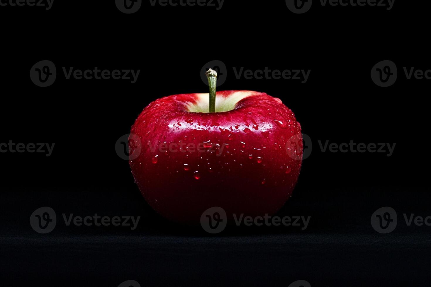A red apple is shown on a black background photo