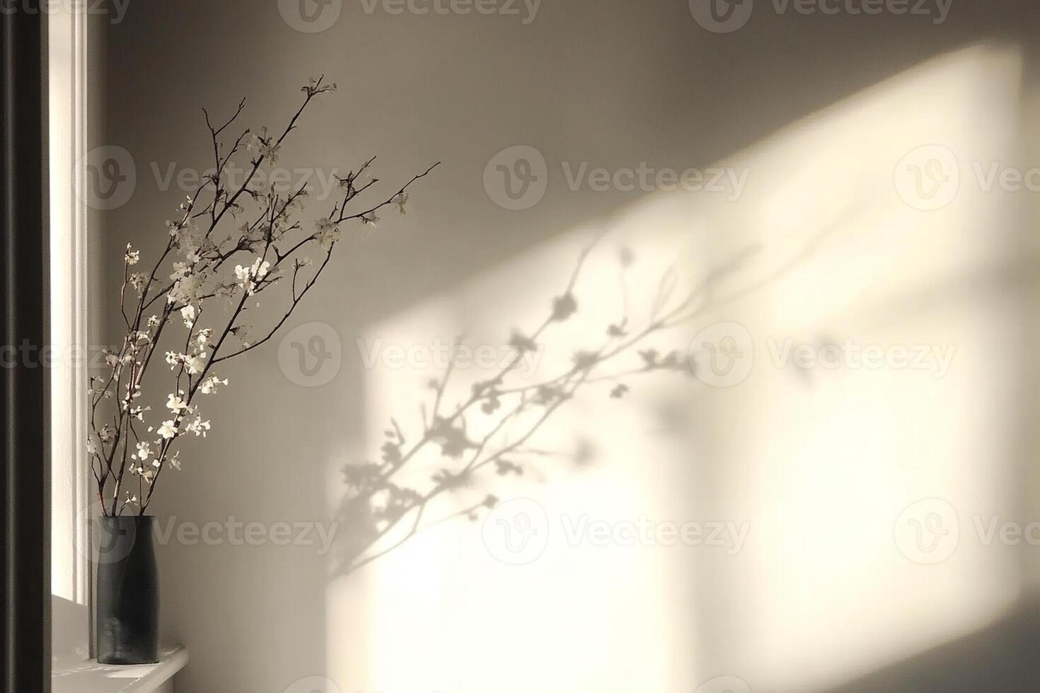 A vase with flowers in front of a window photo