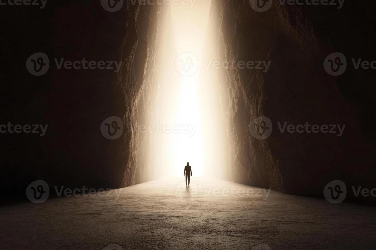 A person standing in the middle of a dark tunnel photo