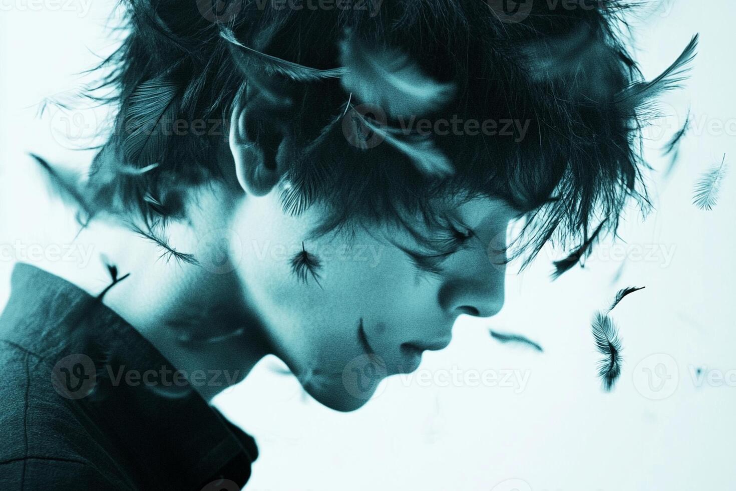 A man with feathers flying around his head photo