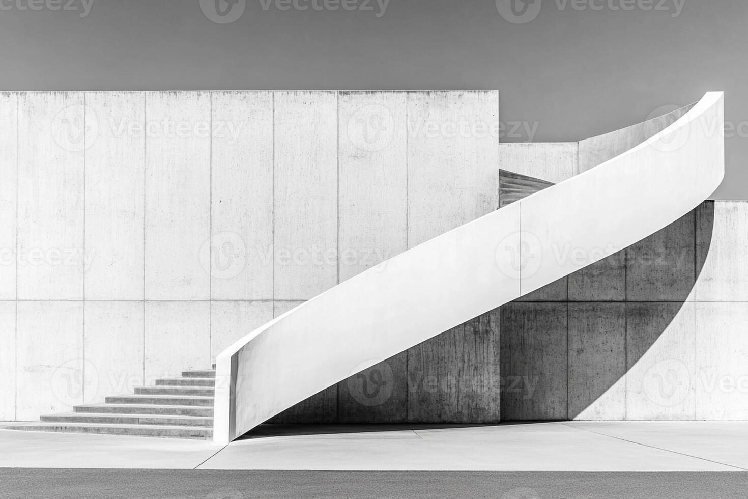 A black and white photo of a concrete staircase
