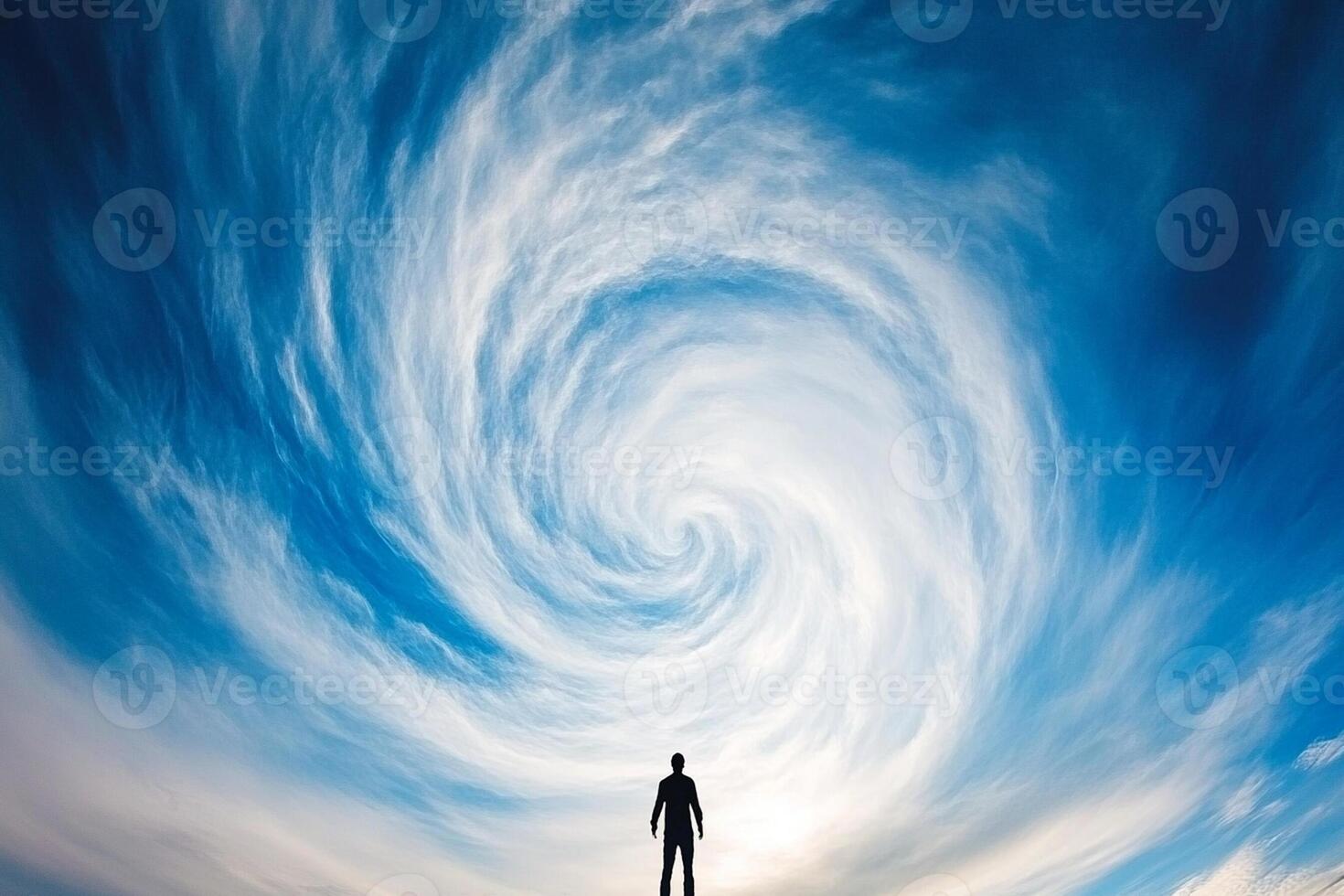 A man standing in front of a swirling vortex photo